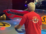 Graeme Frew modelling Red T-shirt with his plane Full Noise 35.